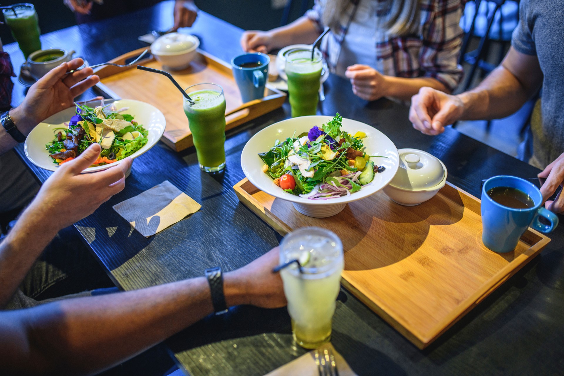 Friends Enjoying Healthy Food and Drink at Paleo Cafe